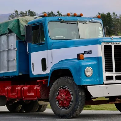 A blue and white International truck