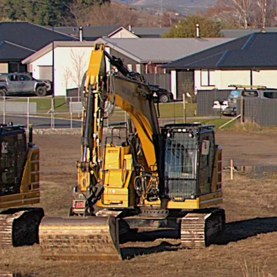 A modern Caterpillar excavator on a building site